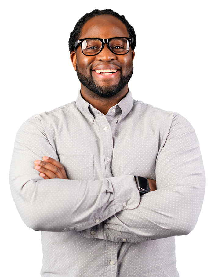 A person is wearing a button-up shirt with small dots and a smartwatch on the left wrist, with arms crossed.