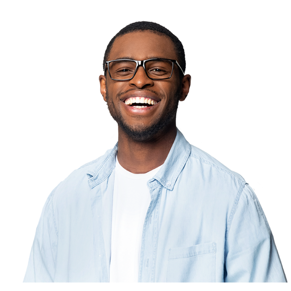 A smiling person wearing a denim shirt over a t-shirt.
