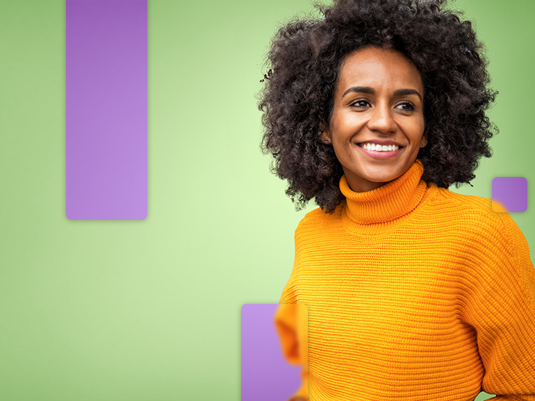Person with curly hair and turtleneck sweater